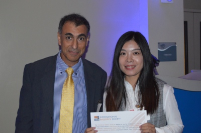 Yipin LV receiving her Student Award certificate from Sidney Chocron