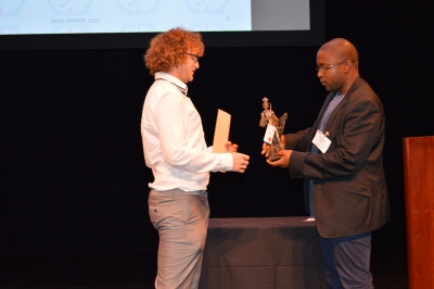 Huon Bornstein receiving the SABO Award from Tleyane Sono