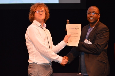 Huon Bornstein receiving the SABO Award and certificate from Tleyane Sono