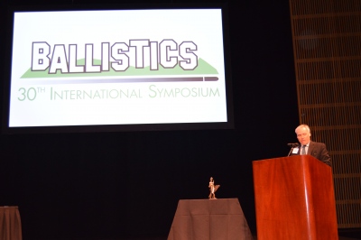 James Walker making an announcement during the last day of the symposium